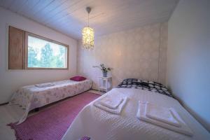 Postel nebo postele na pokoji v ubytování Villa ArcticFox Rovaniemi