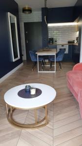 Posedenie v ubytovaní Apartament ROYAL Mielno Sosnowa 4