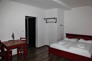 Postel nebo postele na pokoji v ubytování Aparthotel Mádr