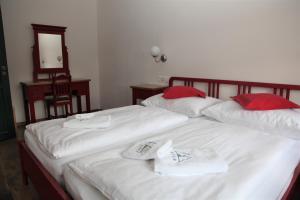 Postel nebo postele na pokoji v ubytování Aparthotel Mádr