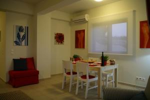 a dining room with a table and chairs at Villa Brio Exclusive in Skala
