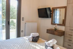 Posteľ alebo postele v izbe v ubytovaní PAUL'S VILLA PLAKIAS