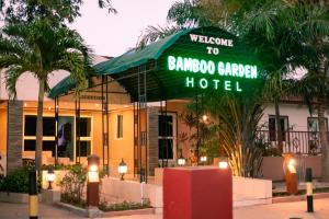 a hotel sign in front of a building at Bamboo Garden Hotel in Serekunda