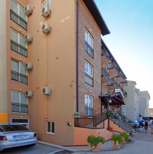 a building with a car parked in front of it at Pansion LUCIA & MARIA Međugorje in Međugorje +23 photos