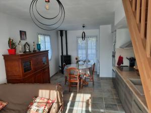 a kitchen and dining room with a table and chairs at Le boisnheur in Gap