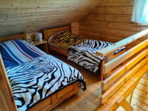 Posteľ alebo postele v izbe v ubytovaní Chatki U Hanusi + 30 fotografií