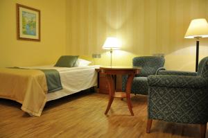 Łóżko lub łóżka w pokoju w obiekcie Hotel Mir-Jan SPA