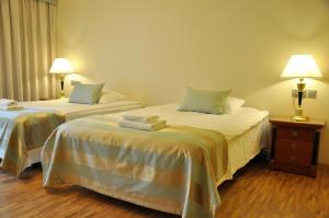 Łóżko lub łóżka w pokoju w obiekcie Hotel Mir-Jan SPA