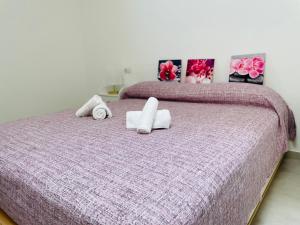 Postel nebo postele na pokoji v ubytování B&B S'arciaredda