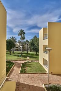 a view of a park from a building at Parque Mourabel, Oásis Village & Pé do Lago in Vilamoura