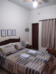 Ένα ή περισσότερα κρεβάτια σε δωμάτιο στο Pousada Capão da Coruja