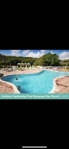 a picture of a swimming pool monarchy bay resort at Newquay Bay Porth Caravan - 6 berth in Newquay