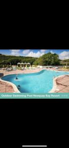 a picture of a swimming pool monarchy bay resort at Newquay Bay Porth Caravan - 6 berth in Newquay