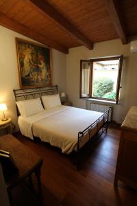 a bedroom with a bed in a room with a window at La casa dell' artista in Turin