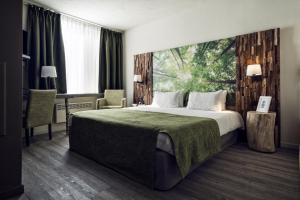 Postel nebo postele na pokoji v ubytování Hotel Zuid
