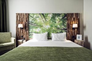 Postel nebo postele na pokoji v ubytování Hotel Zuid