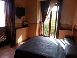 Letto o letti in una camera di Hotel Il Barocco