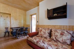 a living room with a couch and a table at Penzion Pulčiny 43 in Pulčín