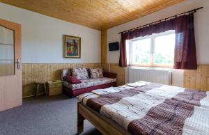 Postel nebo postele na pokoji v ubytování Penzion Pulčiny 43