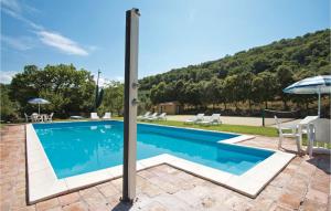 a swimming pool in a villa with a mountain in the background at Casa Cantina in Magione +19 photos