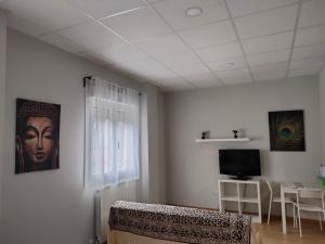 Televizorius ir (arba) pramogų centras apgyvendinimo įstaigoje Apartamento coqueto ideal parejas