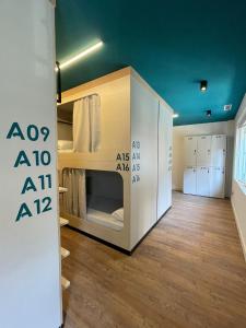 a room with a room with bunk beds in it at Bulezen Urban Hostel in Pontevedra
