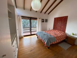 Postel nebo postele na pokoji v ubytování Casona Girasol - BBQ Cocina Piscina Wifi
