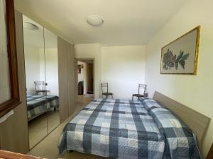A bed or beds in a room at casa RIFUGIO OLIVIERI