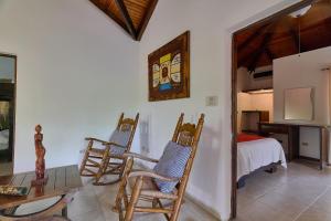 TV a/nebo společenská místnost v ubytování Villa Bayacanes con piscinas privadas