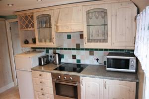 A kitchen or kitchenette at Robertsbridge Retreat At Cornhill Luxury Self Catering Apartments 