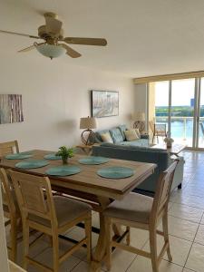 a living room with a table and a couch at Beautiful Miami Place in Miami Beach