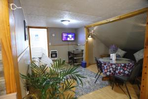 a small room with a table and a table at 3-Bedroom apt. ideal location near new river gorge in Fayetteville