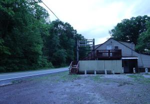 a house on the side of a road at 3-Bedroom apt. ideal location near new river gorge in Fayetteville
