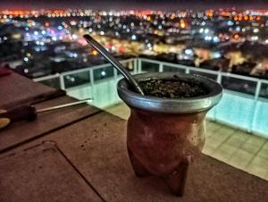 a pot with a spoon sitting on top of a building at Departamento Albaluz Barrio Sur in San Miguel de Tucumán