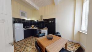 Kuchyň nebo kuchyňský kout v ubytování Le Casimir - Appartement de standing 90m2 - Carcassonne centre
