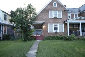 a house with a tree in the front yard at 3 bedroom one bathroom townhouse - 20B Elm street Charlton Heights WV 25040 in Glen Ferris