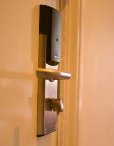 a close up of a door with a lock at Piccadilly Hotel in Bournemouth