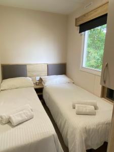 Katil atau katil-katil dalam bilik di Modern & Homley 3BR Caravan