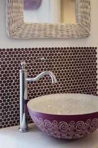 a sink with a faucet in a bathroom at DormidaNoi B&B in Civitanova Marche +10 photos