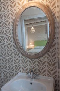 a bathroom with a sink and a mirror at DormidaNoi B&B in Civitanova Marche