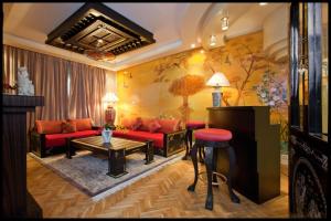 Coin salon dans l'établissement Art Palace Suites & Spa