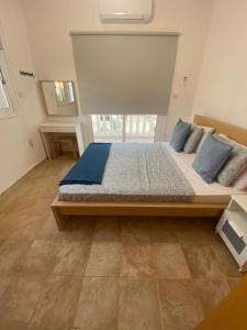 a bedroom with a large bed in a room at Villa suncity Boutique Beachfront in Ayia Napa