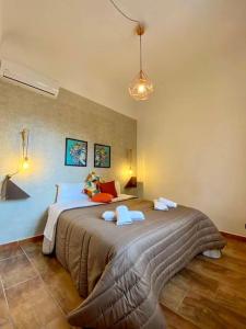 Postel nebo postele na pokoji v ubytování Baddar'Home . . . experience of real Palermo
