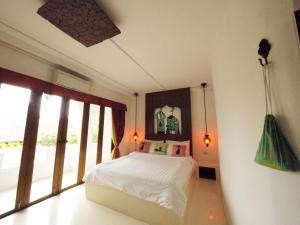 เตียงในห้องที่ Riad Hua Hin