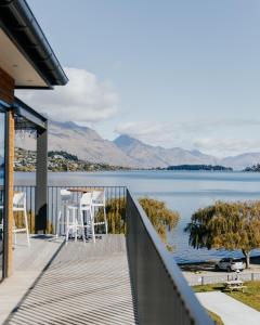 a balcony with a view of the water at Driftaway Queenstown in Queenstown