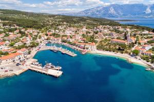 an aerial view of a harbor with boats in the water at Apartments and rooms by the sea Sumartin, Brac - 2953 in Sumartin