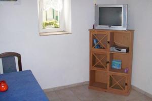 Телевизия и/или развлекателен център в Apartment Jezera 5057f