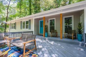 a porch of a house with chairs on it at King Bd Nature Haven Dwntwn Alpharetta! Dogs Kids in Alpharetta