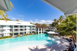an aerial view of the resort with a large swimming pool at Beach Club Port Douglas 3 Bedroom Penthouse in Port Douglas