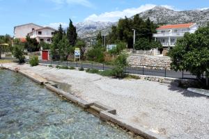 a body of water with houses and trees and buildings at Apartments with parking space Starigrad, Paklenica - 11683 in Starigrad
